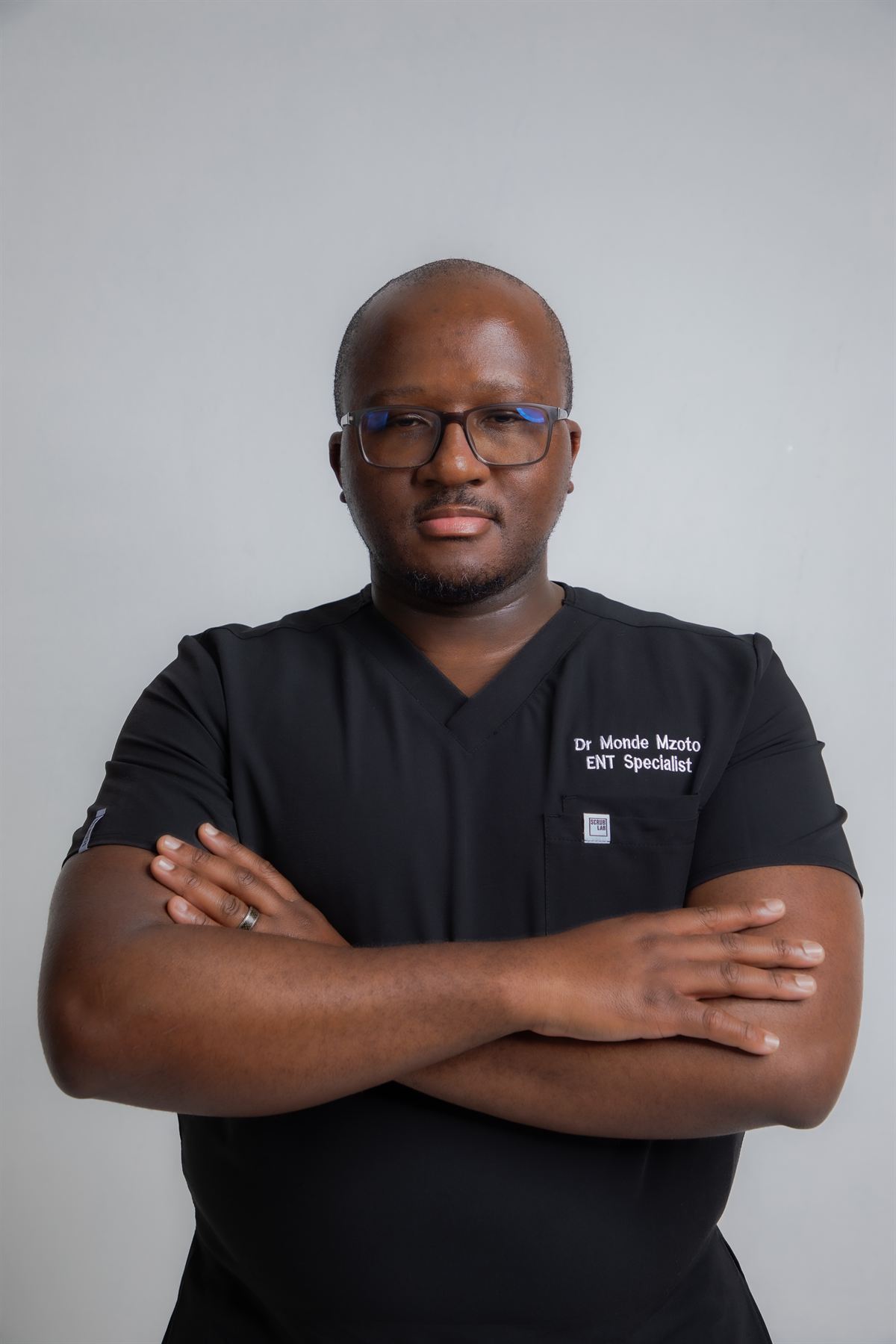 Dr Monde Mzoto in his ENT Specialist scrubs