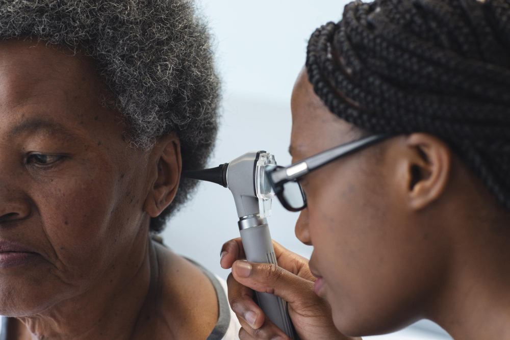 An ear being examined with an otoscope