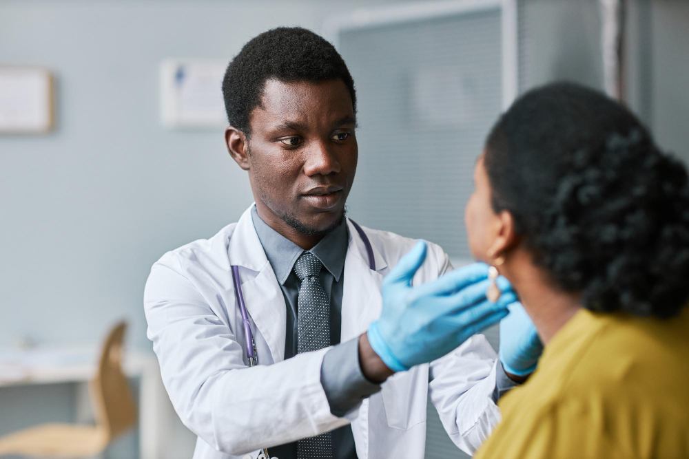 A doctor examining a patient's throat